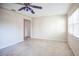 Living room with ceiling fan, speckled flooring, and window at 11357 116Th Ave, Largo, FL 33778