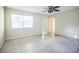 Living room with ceiling fan, window, and door access at 11357 116Th Ave, Largo, FL 33778