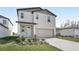 Charming two-story home featuring a two car garage and neutral siding at 3910 Radiant Mountain Dr, Plant City, FL 33565