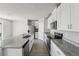 Kitchen featuring stainless steel dishwasher, microwave, granite countertops, and tile flooring at 3910 Radiant Mountain Dr, Plant City, FL 33565