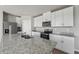 Bright kitchen featuring white cabinetry, granite countertops, and stainless steel appliances at 3910 Radiant Mountain Dr, Plant City, FL 33565