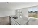 Kitchen island with granite countertops, stainless steel dishwasher, and double sink at 3910 Radiant Mountain Dr, Plant City, FL 33565