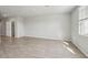 Neutral living room featuring tile flooring, and natural light at 3910 Radiant Mountain Dr, Plant City, FL 33565