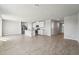 Bright living room featuring tile flooring and open concept kitchen at 3910 Radiant Mountain Dr, Plant City, FL 33565