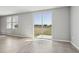 Bright living room with neutral tile flooring and sliding glass door at 3910 Radiant Mountain Dr, Plant City, FL 33565