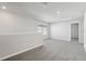 Spacious loft area offers lots of natural light and plush gray carpeting at 3910 Radiant Mountain Dr, Plant City, FL 33565
