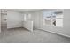 Bright and open loft area features neutral walls and plush gray carpeting at 3910 Radiant Mountain Dr, Plant City, FL 33565