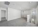 A large, open loft area with carpet flooring and neutral paint at 3910 Radiant Mountain Dr, Plant City, FL 33565
