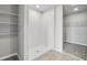 An ample tile shower stall and adjacent open closet space are well-lit by overhead lighting at 3910 Radiant Mountain Dr, Plant City, FL 33565