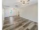 Open living area with neutral walls and wood-look flooring at 1006 Ewing Ave, Clearwater, FL 33756