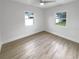 Second bedroom with large windows and light floors at 2585 15Th N Ave, St Petersburg, FL 33713
