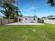 Large backyard with a grassy area and concrete patio at 2585 15Th N Ave, St Petersburg, FL 33713
