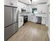 Modern kitchen with stainless steel appliances and white cabinets at 2585 15Th N Ave, St Petersburg, FL 33713