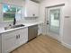 Modern kitchen with white shaker cabinets, stainless steel appliances, and quartz countertops at 2585 15Th N Ave, St Petersburg, FL 33713