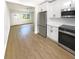 Open concept kitchen with stainless steel appliances and white cabinetry at 2585 15Th N Ave, St Petersburg, FL 33713