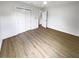 Well-lit bedroom with light wood flooring and closet at 2585 15Th N Ave, St Petersburg, FL 33713
