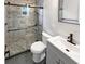 Updated bathroom with a walk-in shower and gray tile at 2585 15Th N Ave, St Petersburg, FL 33713