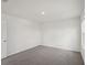 A well-lit bedroom featuring neutral carpeting and a window for natural light at 14033 Crutchfield Ct, Parrish, FL 34219