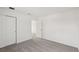 An open bedroom with sliding closet doors and neutral carpet at 14033 Crutchfield Ct, Parrish, FL 34219