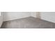 Bedroom featuring neutral carpeting, baseboard trim, and a door leading to the bathroom at 14033 Crutchfield Ct, Parrish, FL 34219