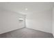 A well-lit room with neutral carpeting and a single window at 14033 Crutchfield Ct, Parrish, FL 34219