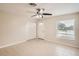 Spacious bedroom with tile floors, double closet, and window at 6445 Skyline Ct, Spring Hill, FL 34606