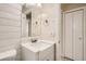 Updated bathroom with white shiplap and quartz vanity at 6445 Skyline Ct, Spring Hill, FL 34606