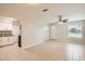Open concept kitchen and living area with tile floors at 6445 Skyline Ct, Spring Hill, FL 34606