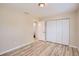 Spacious bedroom with wood-look floors and built-in closet at 6445 Skyline Ct, Spring Hill, FL 34606