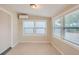 Bright sunroom with tile floors and window blinds at 6445 Skyline Ct, Spring Hill, FL 34606