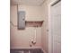Laundry area with electrical panel and shelving at 6445 Skyline Ct, Spring Hill, FL 34606