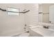 Modern bathroom with white subway tile and quartz countertop at 6445 Skyline Ct, Spring Hill, FL 34606