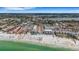 Aerial view highlights the property's prime location near the beach, perfect for enjoying waterfront activities and stunning views at 1129 Seaside Dr # 7, Sarasota, FL 34242