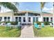 Charming condos boast crisp white facades and quaint blue accents, promising a delightful coastal living experience at 1129 Seaside Dr # 7, Sarasota, FL 34242