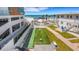 Outdoor shuffleboard court surrounded by landscaping at 1129 Seaside Dr # 7, Sarasota, FL 34242
