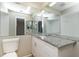 Bathroom with granite countertops and double sinks at 8018 Idle Briar Ln, Port Richey, FL 34668