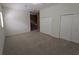 Bright, spacious bedroom featuring three closets, neutral walls, and plush carpeting, offering comfort and ample storage at 23713 Acorn Hill Dr, Lutz, FL 33559