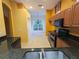 Modern kitchen with stainless appliances, granite countertops, and tile flooring at 23713 Acorn Hill Dr, Lutz, FL 33559