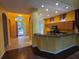 Open concept kitchen with bar seating and views into the front entrance at 23713 Acorn Hill Dr, Lutz, FL 33559