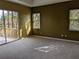 A spacious main bedroom with access to a private balcony and ample closet space at 23713 Acorn Hill Dr, Lutz, FL 33559