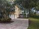 Two-story home with mature trees and a shed at 23713 Acorn Hill Dr, Lutz, FL 33559