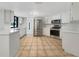 Modern kitchen with stainless steel appliances and white cabinets at 18978 Mcgrath Cir, Port Charlotte, FL 33948