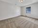 Well-lit bedroom with carpet flooring and a closet at 18978 Mcgrath Cir, Port Charlotte, FL 33948