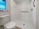 Clean bathroom featuring a shower and toilet at 18978 Mcgrath Cir, Port Charlotte, FL 33948