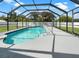 Inviting swimming pool with screened enclosure at 18978 Mcgrath Cir, Port Charlotte, FL 33948