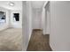 Bright hallway with carpet and access to bedrooms at 18978 Mcgrath Cir, Port Charlotte, FL 33948