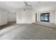 Open living and dining area with neutral carpeting and access to the pool at 18978 Mcgrath Cir, Port Charlotte, FL 33948