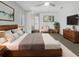 Main bedroom with a king-size bed, ensuite bathroom, and plenty of closet space at 18978 Mcgrath Cir, Port Charlotte, FL 33948