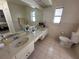 Updated bathroom with double vanity and toilet at 20102 Lorenzo Ave, Port Charlotte, FL 33952