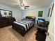 Spacious bedroom with a striped comforter and built-in dresser at 20102 Lorenzo Ave, Port Charlotte, FL 33952